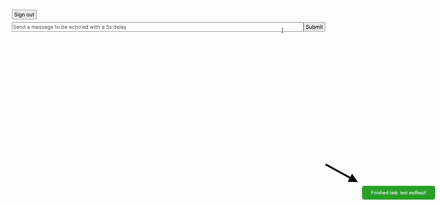 メッセージ入力欄と、右下の緑色のタスク完了通知を表示するデモ画面。