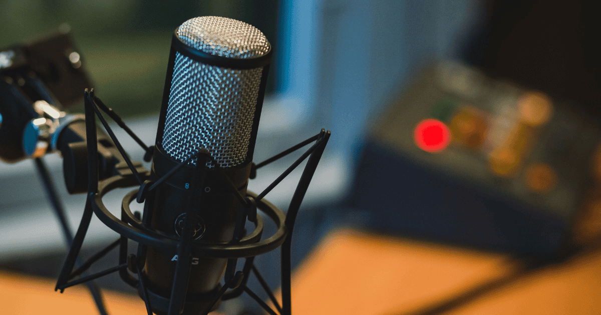 A studio microphone in front of audio equipment