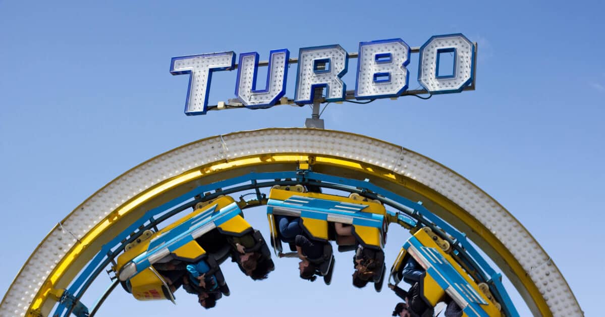 Riders upside down on a Turbo amusement park ride