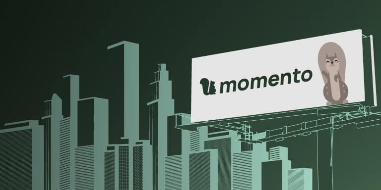 A Momento billboard above an illustrated city skyline